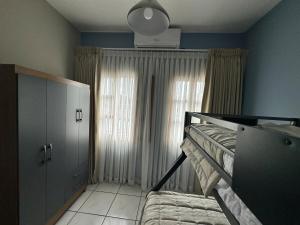a bedroom with a bunk bed and a window at Apartment 1 Peniel in Copán Ruinas +14 photos