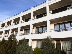 an external view of a white building at Palace Resort in Venus