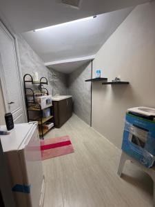 a room with a kitchen with a counter and a room with a unintention at ستديو in Al Baha