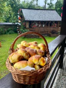 a basket of bread sitting on a table at Veronica’s Guesthouse in Breb
