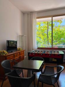 a living room with a table and chairs and a table sidx sidx sidx at K2 Hotel in Cattolica