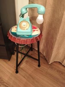 a table with a telephone on top of it at B&B La Torretta dei Ricordi in Formigine