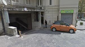 a small car parked in front of a tunnel at Amami Home - Amami Collection in Salerno