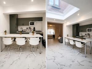 a kitchen with white counter tops and a kitchen with green cabinets at Maison Traversière in Long de Bout