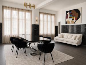 a living room with a table and chairs and a couch at White House Meerane - Loft Sky in Meerane