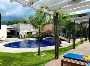 a view of a swimming pool in a resort at Ilha Bela Flat Alter do Chão in Santarém