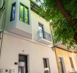 a building with a balcony on the side of it at Casa NOBIL in Alicante