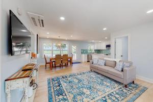 a living room with a couch and a table at The Toasted Oyster in Edisto Island