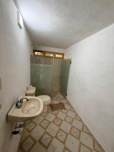 a bathroom with a toilet and a sink and a shower at Cabaña La Joyita By GEstores in Huasca de Ocampo +22 photos