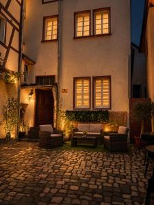 a house with a stone patio in front of it at MiTi Sleep and Go in Bernkastel-Kues +16 photos
