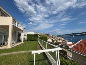a balcony of a house with a view of the water at Villa Pontem in Komarna