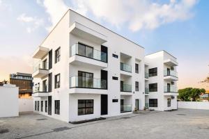 an exterior view of a white building at NewAge Smart 2 in Ikeja
