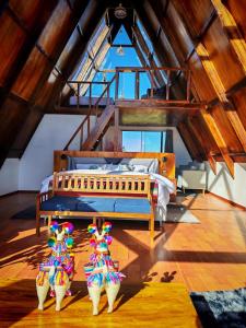 a bedroom with a bed in a room with wooden ceilings at Titicaca wasy lodge in Puno