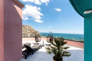 a balcony with a view of the ocean at Spatium Medical & Wellness Hotel in Odesa