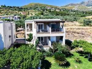 an aerial view of a house on a hill at Billys studios in Karistos +9 photos