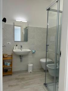 a bathroom with a shower and a sink and a toilet at B&B Nonna Matilde in Sapri