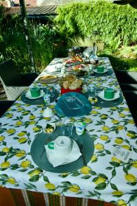 a table with a table cloth with food on it at Les Nymphéas 52 in Orges