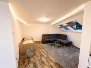 a living room with a couch and a table at Ferien Wohnung in Traben-Trarbach