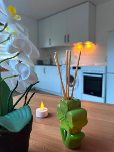 a vase with a flower on a table in a kitchen at Ferien Wohnung in Traben-Trarbach