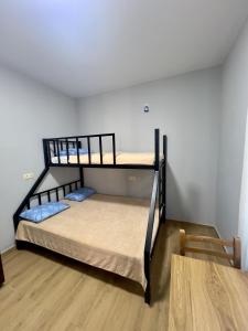 two bunk beds in a room with a table at Maya Seaside Ureki in Ureki +22 photos
