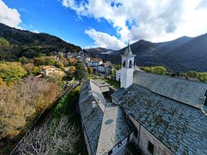 an aerial view of a building with a clock tower at La dolce vita in Zelbio