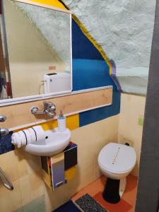 a bathroom with a sink and a toilet at Inspiration room - Toć in Split