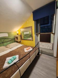 a bedroom with two beds with a mirror and a window at Inspiration room - Toć in Split