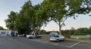 a car parked in a parking lot with trees at Heimathafen Heilbronn in Heilbronn +4 photos