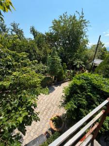 a garden with plants and a walk way at Rezo's Ranch Cottage in Samtredia