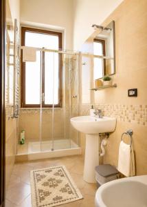 a bathroom with a sink and a shower at Bed and Breakfast Station in Brindisi