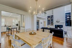 a dining room and living room with a table and chairs at Luna Sea in Edisto Beach