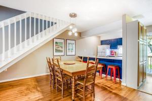 a kitchen and dining room with a table and chairs at The Pirate Den in Edisto Beach +28 photos