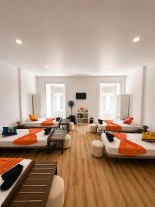a room with a bunch of beds in it at Maria's in Faro