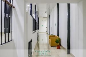 a corridor of an office building with a yellow box at Hotel Casanova in San José