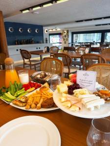 two plates of food on a table in a restaurant at The Rizon Hotel in Antalya
