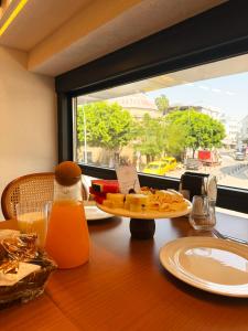 a table with a plate of food and a window at The Rizon Hotel in Antalya