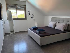 a bedroom with a large bed in a room at Rest&breath in Nir Yafe +16 photos
