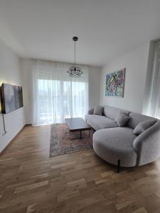 a living room with a couch and a table at Mare Ann in Ljubuški