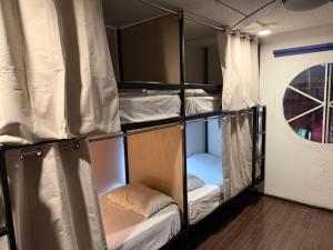 a group of bunk beds in a room at Hostal Vibes in Oaxaca City