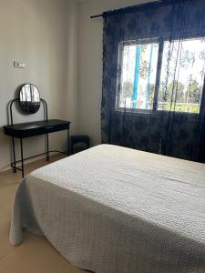 a bedroom with a bed and a window at Alta-Home cabo in Cabo Negro +11 photos