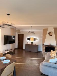 a living room with a couch and a table at Villa Sidoti in Calatabiano