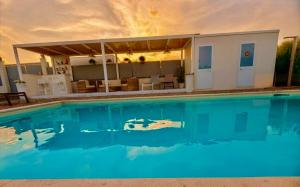 a house with a swimming pool in front of it at Villa Sidoti in Calatabiano