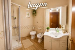 a bathroom with a sink and a toilet and a shower at RESIDENCE ALTAIR Via Roma 13 in Ovindoli +40 photos