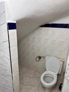 a bathroom with a toilet in a small room at Meknès,hameriya in Meknès +2 photos