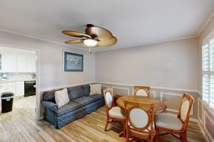 a living room with a couch and a table at Meant To Beach in Edisto Beach