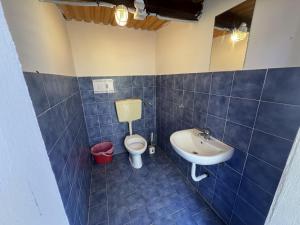 a bathroom with a toilet and a sink at Nurral - TENT in Fertilia +18 photos