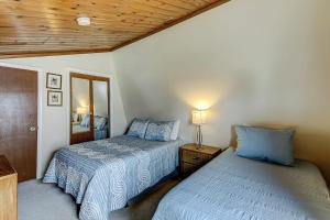 a bedroom with two beds next to each other at Driftwood Villa - 237 in Edisto Beach