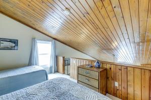 a bedroom with a bed and a wooden ceiling at Driftwood Villa - 237 in Edisto Beach +11 photos