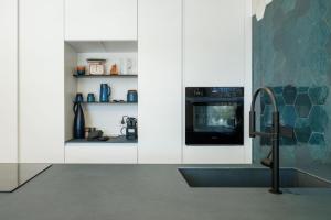 a kitchen with a stove top oven next to a wall at La Prua in Taormina +52 photos