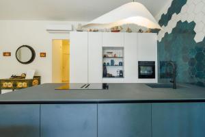 a kitchen with a sink and a counter top at La Prua in Taormina